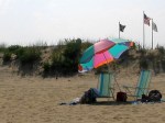 beach umbrella two empty&nbsp;chairs