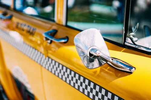 closeup photo of yellow taxi